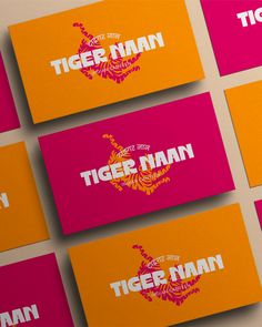 four business cards with the words tiger nann written in orange and pink on them