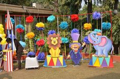 an outdoor area decorated with circus themed decorations