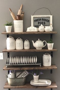 the shelves are filled with dishes and utensils