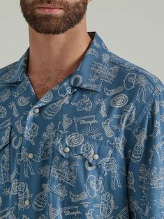 VACATION MODE COWBOY Casual and carefree, Wrangler’s Coconut Cowboy snap-front camp shirt looks to the rich textures and colors in the world around us for inspiration. Taking cue from the classic Hawaiian shirt, this beachside button-up comes with a traditional spread collar, two snap flap pockets, a straight hem, and a bold tropical print with traces of our western roots throughout. It’s crafted from a lightweight cotton blend to keep you comfortable in the warm days ahead. Finish the look with Cowboy Casual, Wrangler Shirts, Long Sleeve Kids, Boys Bottoms, Camp Shirt, Vacation Mode, Boys Pajamas, Navy Shorts, Rich Textures