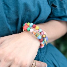 Colorful Kantha beads are strung on memory wire to form the perfect bangle - the endpoints overlap just a bit for interest. Each piece is made from repurposed Sari and Kantha textiles covering a wood base, so colors and patterns are unique and will vary. Measures .75" at the widest point of overlap; easily expands and contracts to fit. Sustainably handmade by women artisans in India. Wrap Bangles, Memory Wire, Women Artisans, Fair Trade, Color Patterns, Wrap Bracelet, Cuff Bracelets, Bangles, Beaded Bracelets