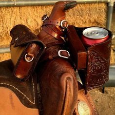 a horse saddle with a can of beer in it