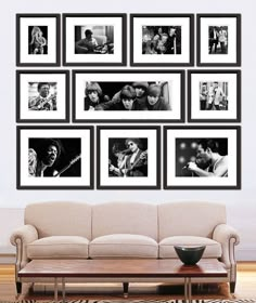 a black and white photo frame with many pictures on the wall above it, all in different sizes