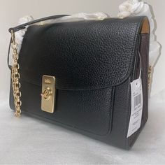 Coach Lane Shoulder Bag New With Original Packaging 100 % Authentic Black Multi With Gold Hardware Refined Pebble Leather Snake-Embossed Leather Inside Multifunction Pocket Center Zip Compartment Turnlock Closure Outside Open Pocket Handles (Convertible) To Shoulder Strap With 19 1/4" Drop Approximate Measurements 10 1/4" L X 7" H X 4" W Coach Lane Shoulder Bag, Designer Bags With Turn-lock Closure, Workwear Shoulder Flap Bag With Branded Hardware, Formal Flap Bags With Branded Hardware, Office Satchel Flap Bag With Branded Hardware, Designer Bags With Gold-tone Hardware For Work, Workwear Bags With Metal Hardware And Flap Shape, Designer Work Bags With Gold-tone Hardware, Office Flap Bag With Branded Hardware