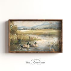 an oil painting of ducks swimming in a pond with mountains in the background and wild country logo