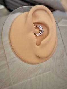 a pair of earring sitting on top of a table