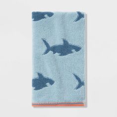 a blue towel with sharks on it