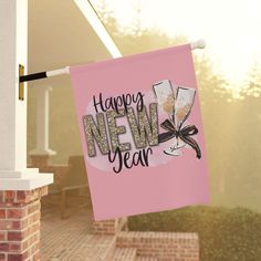 a happy new year banner hanging from a porch