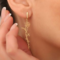 Elevate your style with our beautiful collection of Flower and Name Dangle Earrings. Handcrafted with high-quality materials, including 14K solid gold, 14K plated gold, 925 silver and gold, rose gold, and white gold, these earrings are sure to add a touch of elegance to any look. With their personalized design featuring a flower and a name, our earrings make for a unique and thoughtful gift to yourself or a loved one. Perfect for any special occasion, these handmade earrings are the perfect way Dangle Earrings Silver, Name Earrings, Flower Names, Earrings Christmas, Earrings Flower, Solid Gold Jewelry, Gold Flower, Silver Earrings Dangle, Gold Flowers