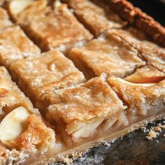 an apple pie is cut into squares and ready to be served in the oven for dessert