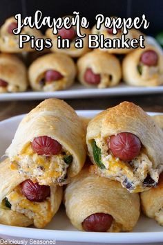 there are several pigs in a blanket on the plate