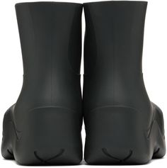 Ankle-high waterproof biodegradable rubber boots in black. · Bonded jersey lining · Textured rubber midsole · Treaded rubber outsole Supplier color: Camping Black Boots With Recycled Rubber Sole, Black Waterproof Boots Made Of Recycled Rubber, Black Waterproof Boots With Recycled Rubber, Black Ankle Rain Boots With Rubber Sole, Puddle Boots, Bottega Veneta Green, Line Texture, Rubber Boots, Sea Salt