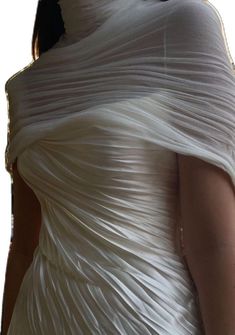 the back of a woman's white wedding dress with pleated fabric on it