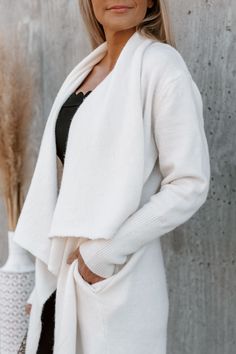 Our "Everyday Style" oversized cardigan jacket is so cozy and cool! This classic cream pocketed cardigan features an open front and long sleeves. Throw this piece on with the "Lamar" tank bodysuit and the "Liam" denim black jeggings! Oversized Jacket Model is 5"7 in a size small Fall Outerwear Pieces Cream Knit Cardigan Open Front Pockets Colors May Vary Patterns May Vary White Long Sleeve Cardigan For Loungewear, Winter White Long Sleeve Loungewear Cardigan, Cozy Everyday Cardigan, Relaxed Fit Open Front Winter Outerwear, Fall Outerwear With Soft Texture For Everyday, White Outerwear For Layering In Fall, White Open Front Cardigan For Winter, White Open Front Cardigan For Fall, Chic Open Front Outerwear For Loungewear