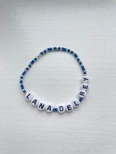 Lana Del Rey beaded bracelet. Made to fit each customers wrist. Can personalise colour of beads Custom Name Beaded Bracelets For Personalized Gift, Personalized Beaded Bracelet Jewelry, Customizable Beaded Bracelets For Personalized Gifts, Blue Name Bracelet With Colorful Beads As Gift, Customizable Beaded Bracelets As Personalized Gift, Personalized Round Beads Casual Jewelry, Customizable Round Beads Bracelet For Personalized Gift, Casual Personalized Jewelry With Round Beads, Personalized Casual Jewelry With Round Beads