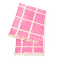 a pink and white checkered blanket with fringes on the ends, against a white background