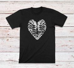 Skeleton Heart Black & White T-Shirt - Halloween Shirt for Men, Women, Kids and Baby Bodysuits - Great gift idea for Halloween shirts for the whole family  View more Halloween Skeleton Shirts  --> https://www.etsy.com/shop/craftsofhumanity?section_id=29946568 Customized Halloween Shirts for Him or Her - we have Youth Kid Sizes available and Baby Bodysuits for this design! This shirt is a great gift idea for all ages - kids will love it for back to school and Halloween! Quality is important to us Cheap Black Stretch Bodysuit, Cheap Black Tops With Heart Graphic, Cheap High Stretch Bodysuit, Halloween Costume Skeleton, Skeleton Shirts, Costume Skeleton, Graphic Tee Men, Skeleton Heart, Idea For Halloween