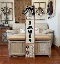 a wooden sign that says happy new year with a dog on it in front of a couch