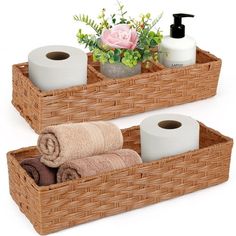 two wicker baskets with towels and toiletries in them, one is holding rolls of toilet paper