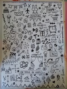 a sheet of paper with doodles on it and some writing in black ink next to the