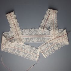 An antique filet lace camisole yoke, unused and in perfect condition.  The lace has been threaded with a new dusky rose coloured ribbon. Laid flat and open the yoke is 91 cm [36 cm]  wide and  25 cm [10"]deep. [Top of the shoulder strap to the bottom of the lace.] The lace is suitable for topping a chemise, nightgown or even a light summer dress. The lace is soft white in colour. Any excess postage on multiple orders will be refunded in full.       Antique and vintage items will rarely be perfec Filet Lace, Lace Chemise, Light Summer Dresses, Lace Straps, Summer Wines, Lace Camisole, Lace Ribbon, Linens And Lace, French Lace