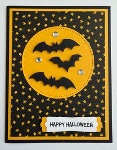 a black and yellow halloween card with bats