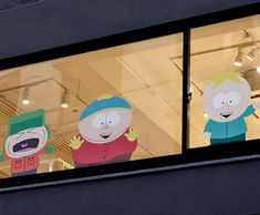 three cartoon characters are displayed in the window