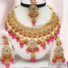 "Latest Pearls Touch Bollywood Wedding Designer Bridal Kundan Zircon Choker Necklace Jewelry Earrings,Tikka Set. This product is handmade & hence the product can be non-uniform & vary in color & texture. Color : Pink Gorgeous Zircon Gold Plated Necklace jewelry Set 1.Set consists of Necklace, Earrings, Maang Tikka Set 2. Necklace Size:(5.5\"L X 6.5\"W) 3.Necklace Weight: 145 Gm 4.Earrings Length:3.5\" 5.Tikka Length: 5\" EXPEDITED DELIVERY (Chargeable) : Delivered 3 to 4 working days Wedding Necklaces With Stone Setting For Festivals, Festive Kundan Necklace For Weddings With Stone Setting, Kundan Necklace For Wedding And Festivals With Stone Setting, Festival Wedding Kundan Necklace With Stone Setting, Pink Stone Work Bridal Earrings For Wedding, Bridal Necklace With Stone Setting For Wedding, Festive Wedding Jewelry Sets With Stone Setting, Wedding Bridal Necklace With Stone Setting, Pink Jeweled Bridal Necklace For Wedding