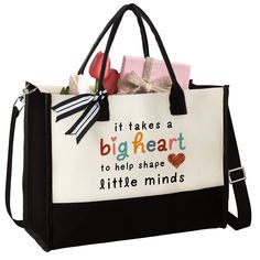 a black and white shopping bag with words on it