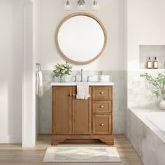 a bathroom with a sink, mirror and bathtub