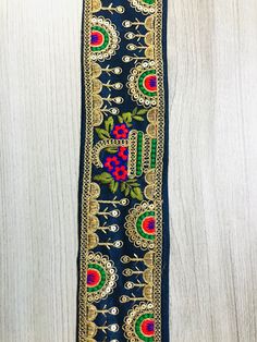 Embroidered Trimmings Ribbon Saree Border Fabric Trim Indian Sari Border Indian trim, beach bags lace, Embroidered Craft Ribbon, Decorating footwear lace, Indian Saree Trim. This beautiful Lace can be used for designing stylish blouses, shrugs, skirts, tunics, festive wear, wedding wear, and dresses. Hand sewn, home decoration, Arts and Crafts, Ottoman decoration, kids dress, Denim Jacket, etc. Measurements: approximately 3.35 inches wide This listing is sold by 1 yard. For Wholesale Purchase: P Dress Denim Jacket, Stylish Blouses, Border Fabric, Fabric Table Runner, Saree Border, Dress Denim, Sewing Ribbon, Sari Fabric, Indian Fabric