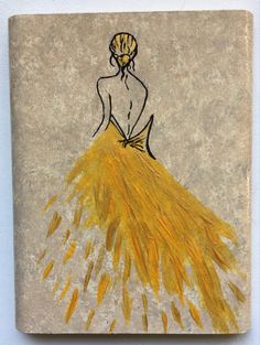 a drawing of a woman in a yellow dress sitting on a stone block with gold feathers