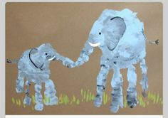 a child's drawing of an elephant and baby elephant on brown paper with grass