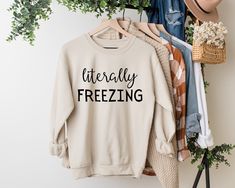 "Literally Freezing Sweatshirt, Bella Canvas Sweatshirt, Gildan Sweatshirt, Winter Sweatshirt, Funny Sweatshirt, Christmas Sweatshirt Welcome to NIOBE BOUTIQUE. I am happy to see you in my shop. My main purpose is to meet you with a high-quality product. I use the best product to make you happy. Your satisfaction is my priority. Placing an order is simple! *Please review all images in this listing for style, color, and sizes. *Select your t-shirt color and size from the drop-down menus. *Choose Cold Sweatshirt, Wifey Shirt, Wifey Sweatshirt, Bride Sweatshirt, Sweatshirt Aesthetic, Cat Mom Shirts, Women Sweatshirt, Sweatshirt Women, Winter Sweatshirt