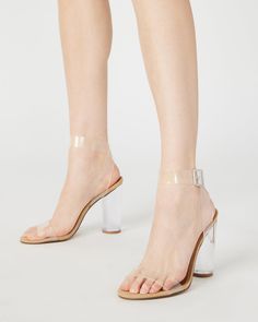 With a modern silhouette and trend-right transparency, CLEARER is a star sandal of the season. This stunner pairs perfectly with minimalist and/or futuristic ensembles. 4 inch heel height PVC upper material Synthetic lining Synthetic sock Synthetic sole Clear lucite heel Imported Trendy Clear Sandals With Wrapped Heel, Trendy Clear Block Heel Sandals, Clear Heels With Transparent Straps And Block Heel, Clear Block Heels With Translucent Outsole, Synthetic Clear Strap Block Heels, Synthetic Block Heels With Clear Strap, Synthetic Block Heel With Clear Strap, Modern Sandals With Transparent Straps, Modern Sandals With Transparent Straps And Open Heel