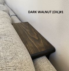 a close up of a couch with the name dark walnut oil on it