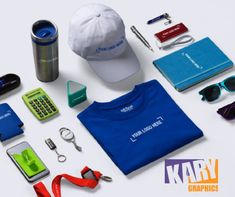 various items are laid out on a white surface including a hat, sunglasses, cell phone, keys, and other items