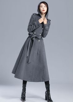 "comfy and chic, this dark gray wool coat featured with a Big hood, designed with long sleeve, double breasted button up closure, two welt pocket at side,and back detailing for a more military look. This darling coat is perfect for this cold season. DETAIL * More color optional https://etsy.me/3AwTfvZ * 50% WOOL,50% POLYESTER * POLYESTER LINING * Epaulet with button * with warm hood * Double Breasted * Hip pockets * Self tie belt waist * button tabs details * Back split vents * Regular fit * mid Gray Wool Coat For Winter Workwear, Gray Pea Coat With Buttons For Winter, Gray Long Pea Coat For Winter, Gray Hooded Outerwear With Buttons, Gray Double-breasted Wool Coat For Fall, Casual Long Coat With Double-lined Hood, Military Style Long Sleeve Hooded Jacket With Double-lined Hood, Military Style Long Pea Coat For Winter, Fitted Military Style Pea Coat With Long Sleeves