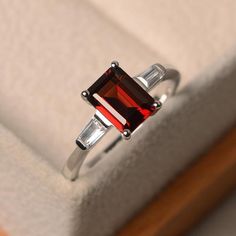 Natural garnet ring promise ring emerald cut red gemstone | Etsy Silver Baguette Cut Ruby Ring For Anniversary, Elegant Garnet Rings In Rectangular Shape, Rectangular Garnet Rings In Elegant Style, Elegant Rectangular Garnet Rings, Red Emerald Cut Birthstone Ring, Emerald Cut Garnet Rings For Gift, Emerald Cut Garnet Rings As Gift, Emerald Cut Red Birthstone Ring, Gift Lab-created Ruby Baguette-cut Jewelry