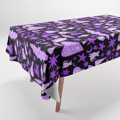 a purple and black table cloth with stars