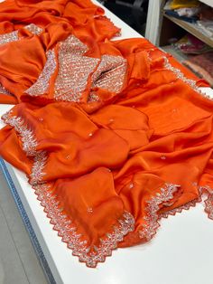 Orange Hand Embroidered Satin Organza Saree.  Heavy Blouse. Designer Georgette Blouse With Embroidered Border, Designer Silk Dupatta For Party, Designer Georgette Dupatta For Diwali, Traditional Georgette Blouse For Celebration, Bollywood Style Georgette Blouse With Embroidered Border, Elegant Embroidered Blouse For Diwali, Elegant Festival Embroidered Fabric, Elegant Silk Embroidered Blouse Piece, Elegant Silk Blouse With Embroidered Border