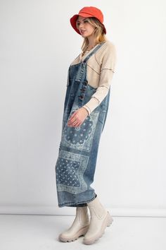 Details Brand: Easel Washed Denim Loose Fit Overalls Bandana Print Details Oversized Silhouette Slouchy and Relaxed Adjustable Straps with Buttons Side Buttons at waist Features front Pocket pouch and back pockets Wide Leg bottoms Distressed Material 95% Cotton 5% Viscose Hand wash cold Dry Flat Measurements of Garment Waist of the garment is measured straight across the top of the waistband then doubled. Rise of the garment is measured down the middle from the top of the waist band to the botto Baggy Overalls, Umgee Clothing, High Neck Jumpsuit, Flannel Tops, Jumpsuit With Sleeves, Bandana Print, Oversized Silhouette, Washed Denim, Printed Denim