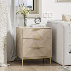 a living room scene with focus on the end table and chair, which has a clock on it