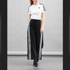 Nwt Adidas Performance W Aekn Snp Pnt Ge5490 Size Small Pull On 3 Stripe Track Joggers Sustainable Streetwear Also A Very Cool Dressy Pant W Heel By Adidas Originals 3 White Trefoil Stripes Unsnaps Up Sides With 9" To Elastic Waist /Adibreak Size: Small Womens/Unisex Waist: 28"Stretch Goes To 30" Inseam Length: Appx 30" Leg Width Bottom: Care Instructions Machine Wash Closure Type Pull On Rise Style: Mid Rise See Pix:) About This Item Sport Trousers Trendy Geek Wider Leg Sportswear Trousers Unis Sporty Adidas Logo Pants, Adidas Three Stripes Pants, White Adidas Jogging Pants, White Activewear With Three Stripes For Jogging, White Adidas Activewear For Streetwear, White Three Stripes Activewear For Jogging, White Activewear With Side Stripes For Sports, White Training Bottoms With Side Stripes, Sporty Bottoms With Side Stripes For Sports