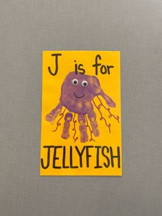 a piece of paper that says j is for jellyfish