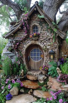 a small house made out of rocks and flowers