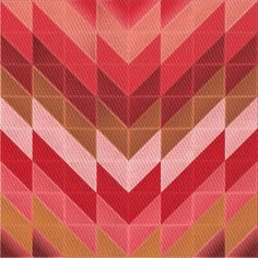 an abstract pattern made up of red, orange and pink squares on fabric with diagonal stripes