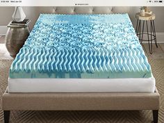 an image of a bed with blue waves on it