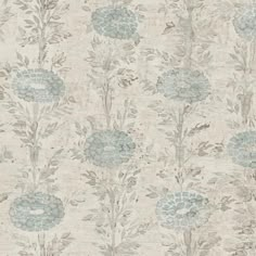 an old wallpaper with blue flowers and green leaves on the bottom half of it