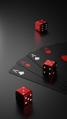 four red dices are sitting on top of each other in front of black cards